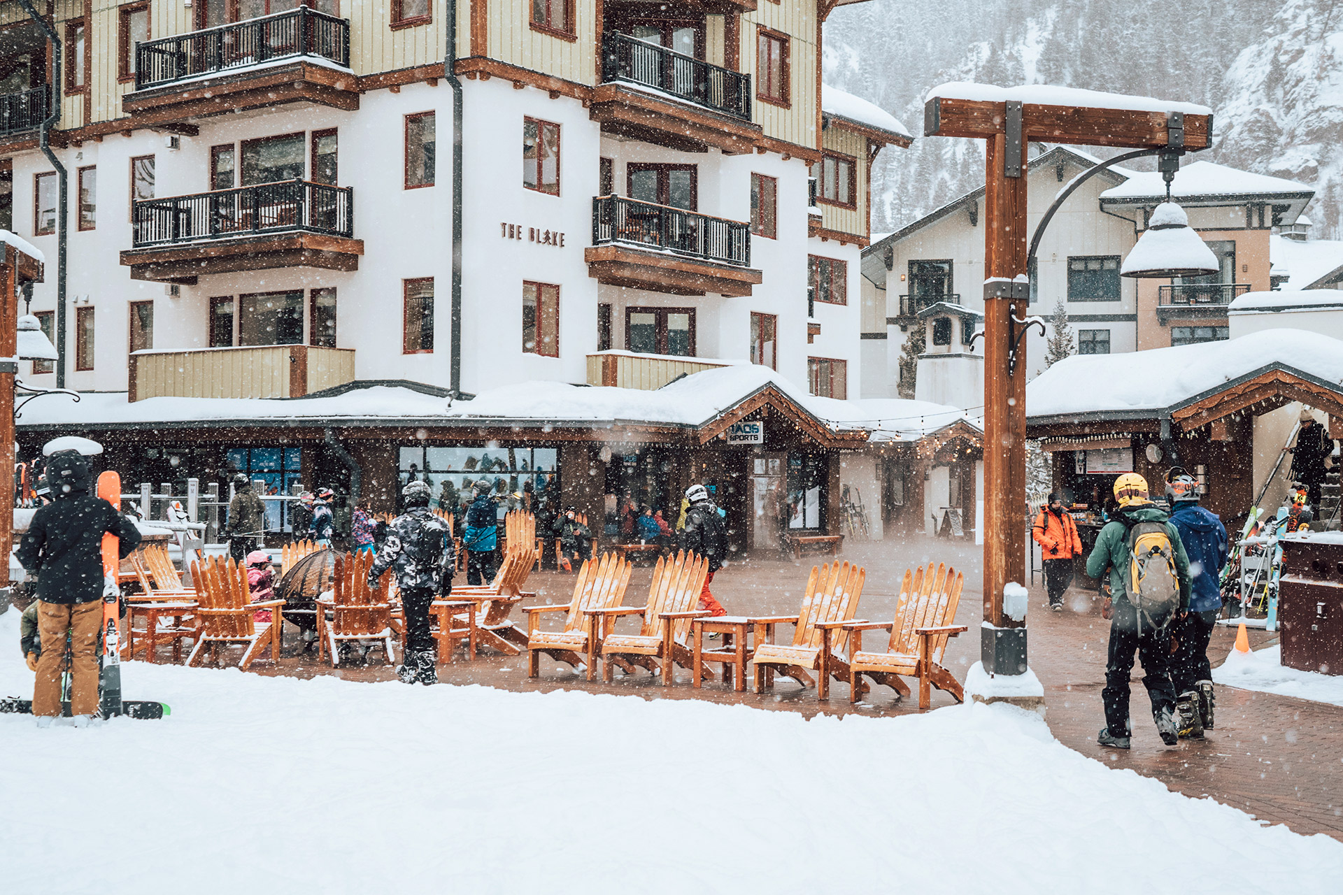 Taos Ski Valley Ski Resort filled with people while it snows