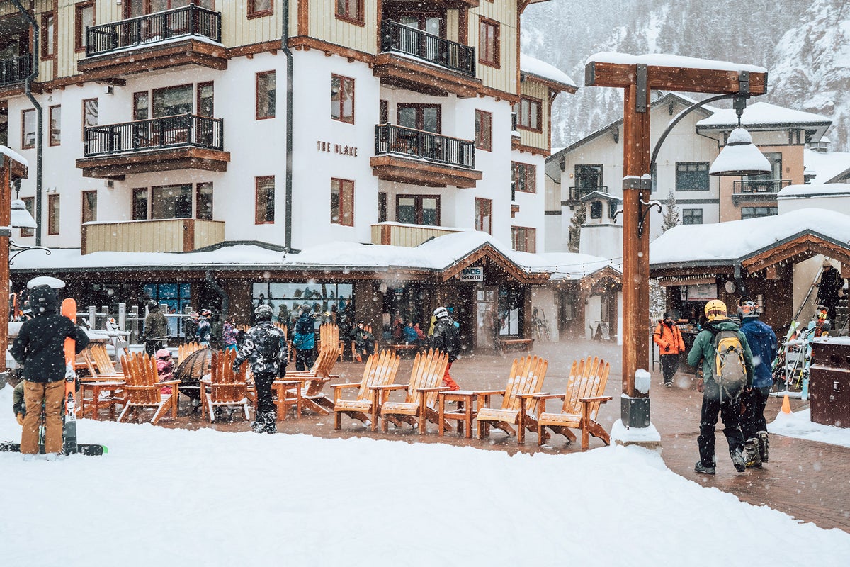 Taos Ski Valley Ski Resort filled with people while it snows