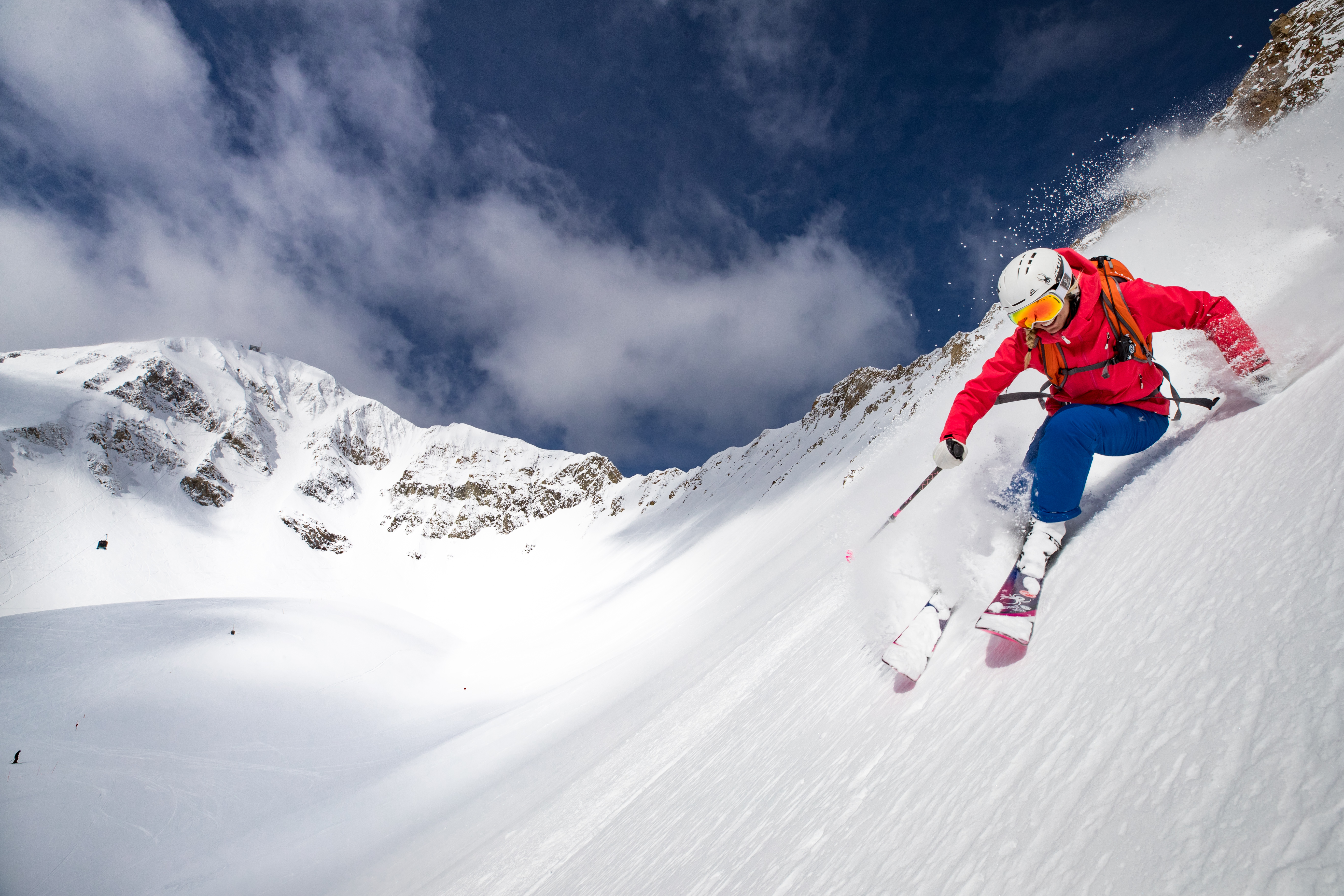 Woman skiing down steep at Big Sky
