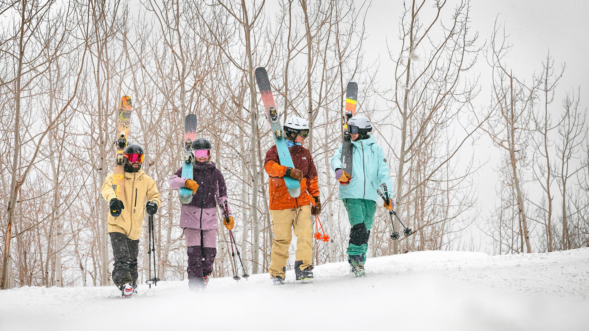 Group of skiers walking in snow while it's snowing