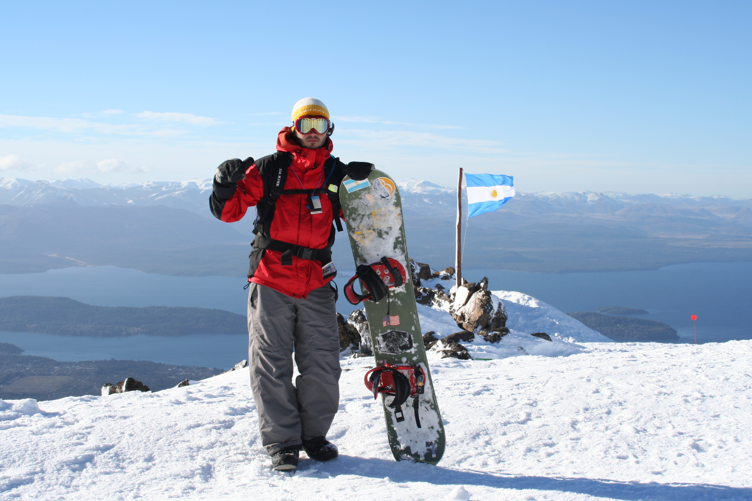 Snowboarder taking a break on a sunny day at Cerro Catedral Resort