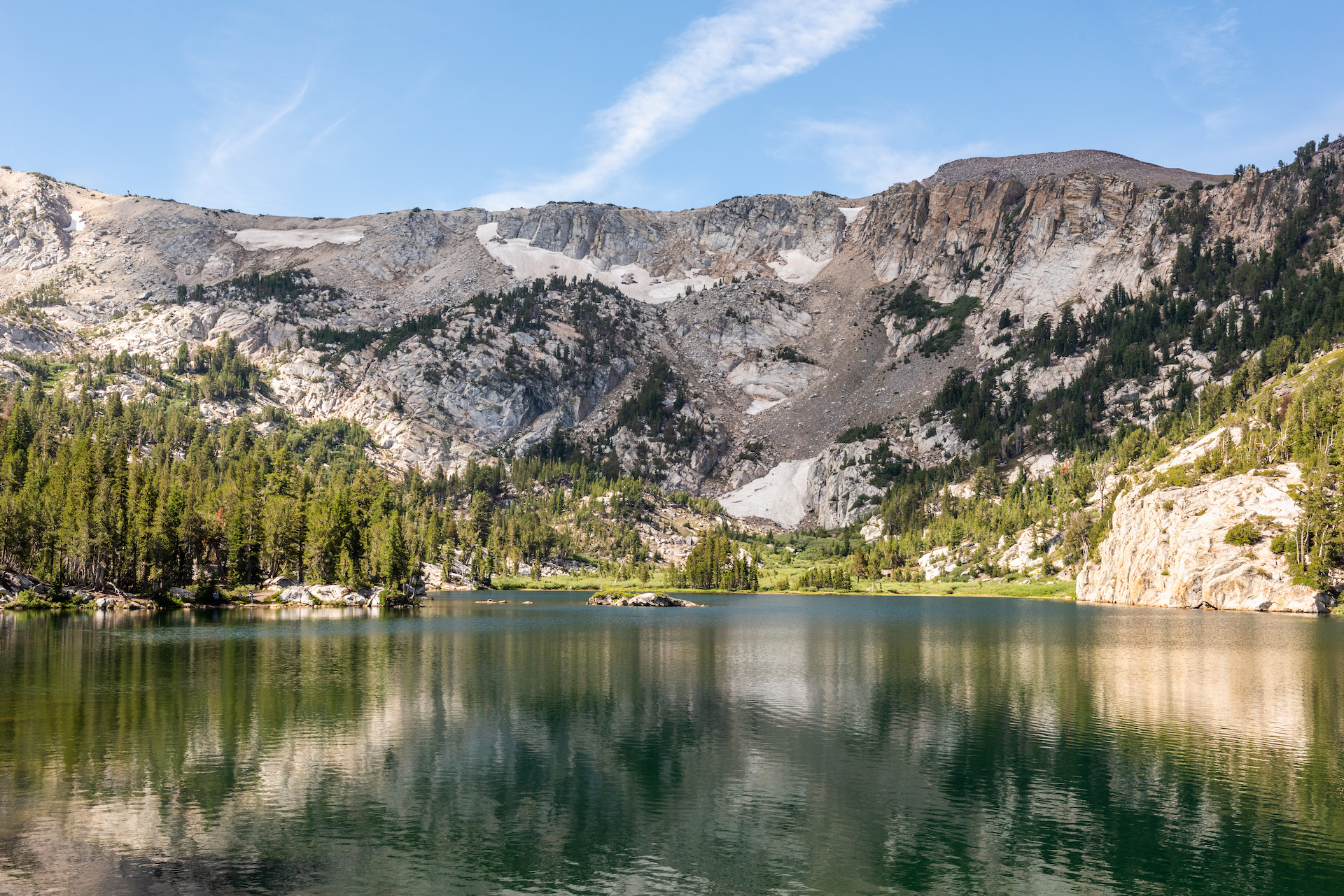 Crystal Lake on a clear, sunny day surrounded by mountains