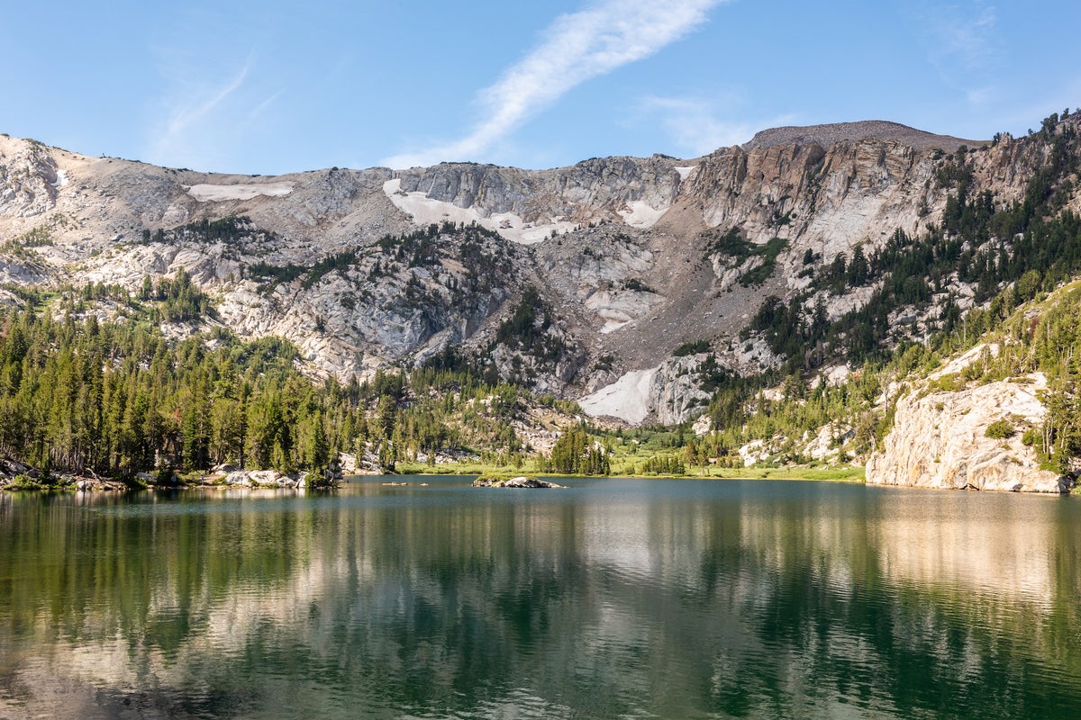 Crystal Lake on a clear, sunny day surrounded by mountains