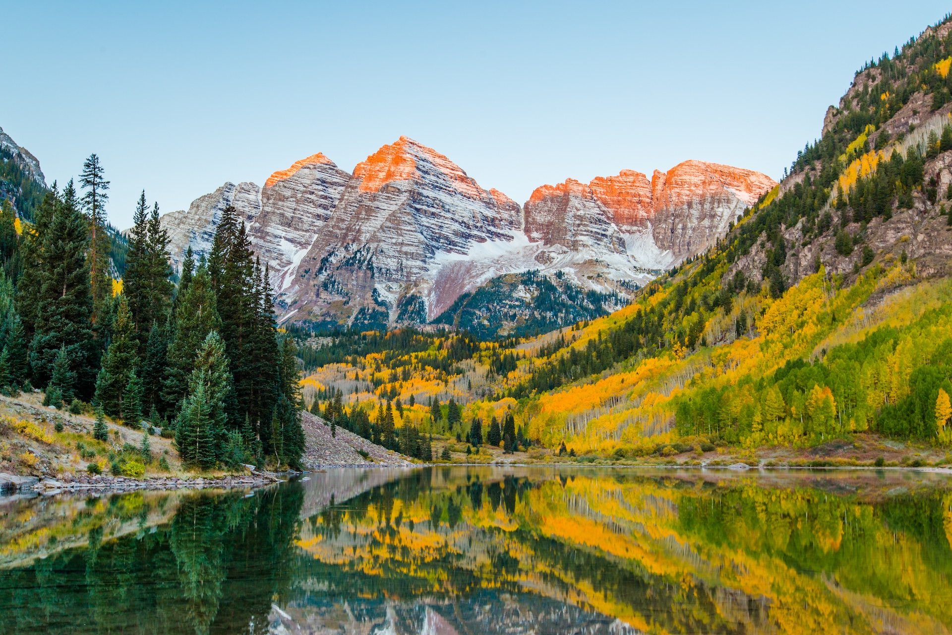 Aspen's Maroon Bells, with a light dusting of snow, on a late fall day with the trees popping with color