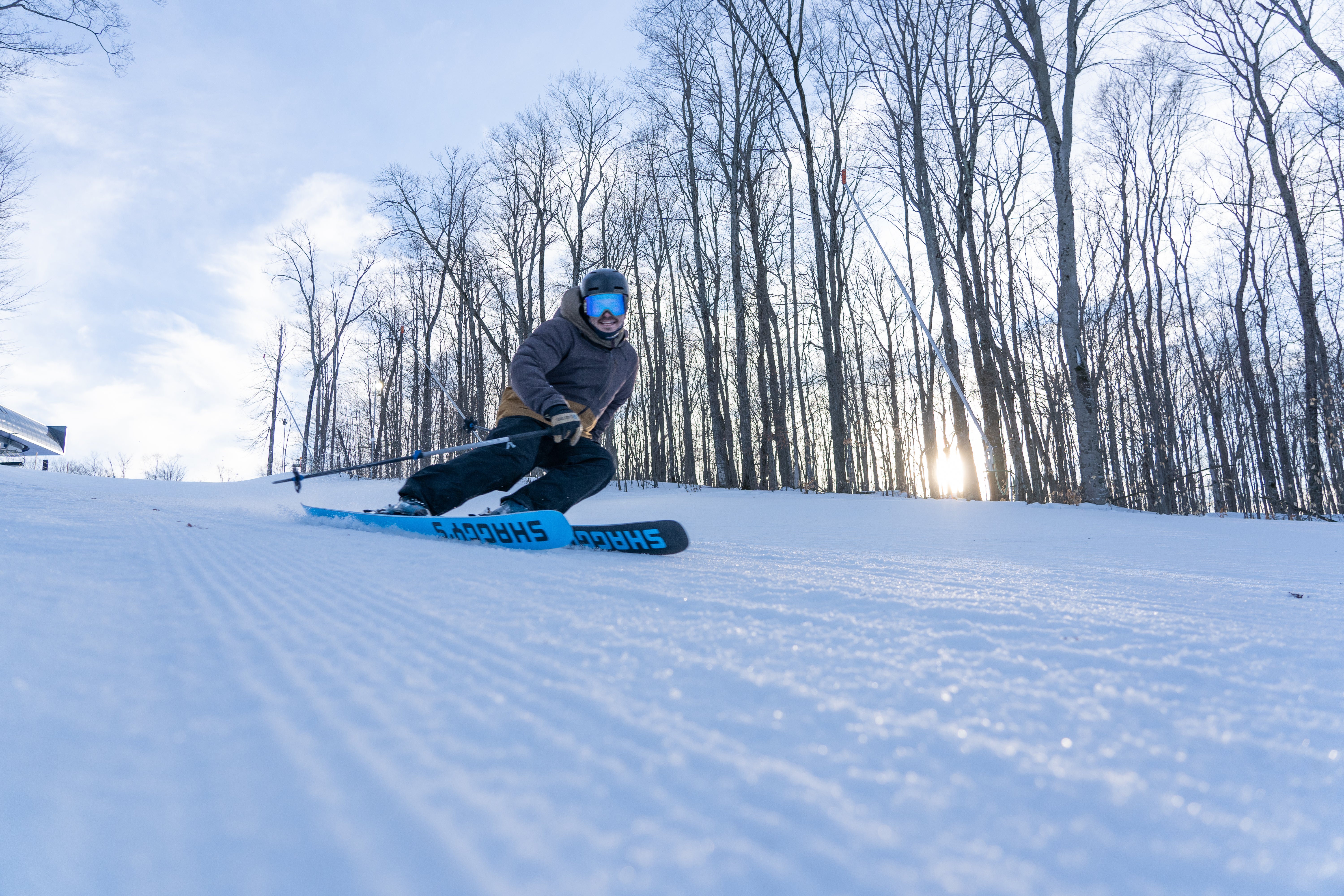 Person skiing first runs of the morning at first light