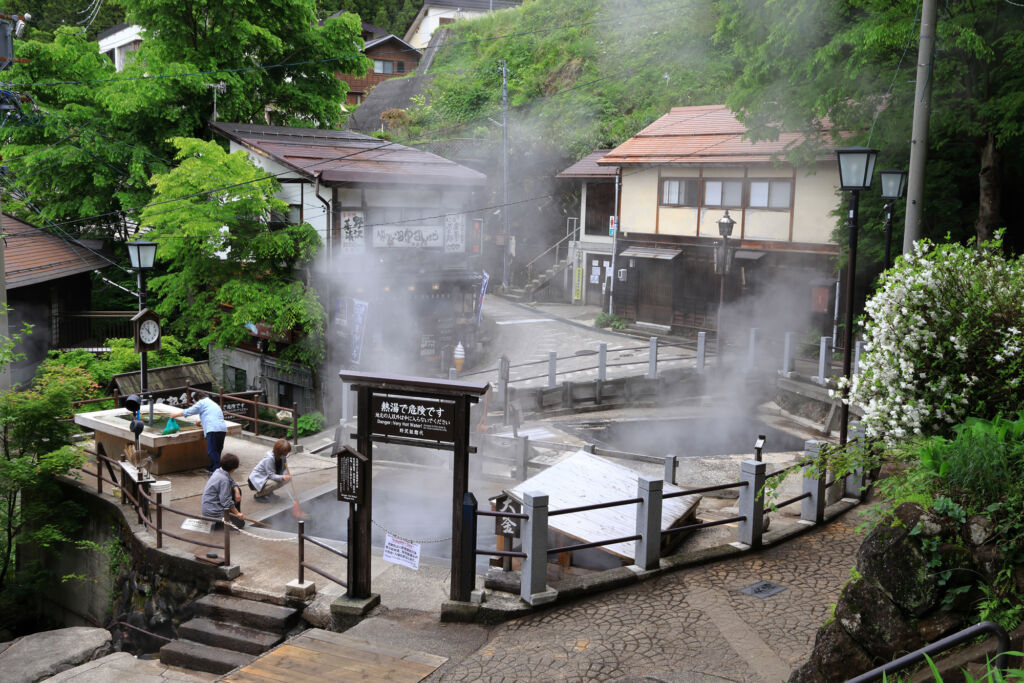 Steam hovering over hot springs at Nozawa Onsen