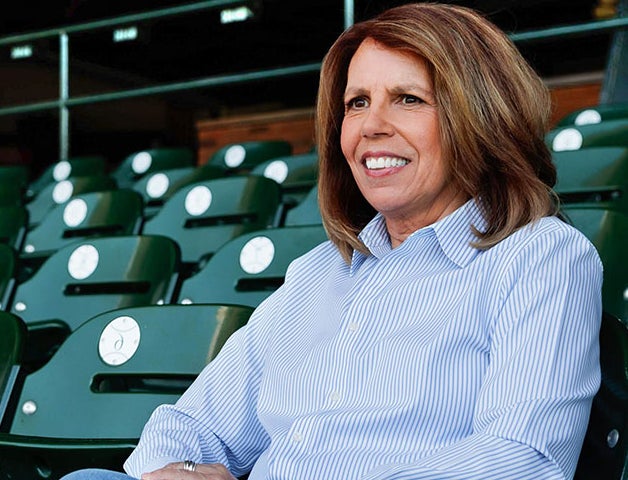 Woman sitting stands at stadium