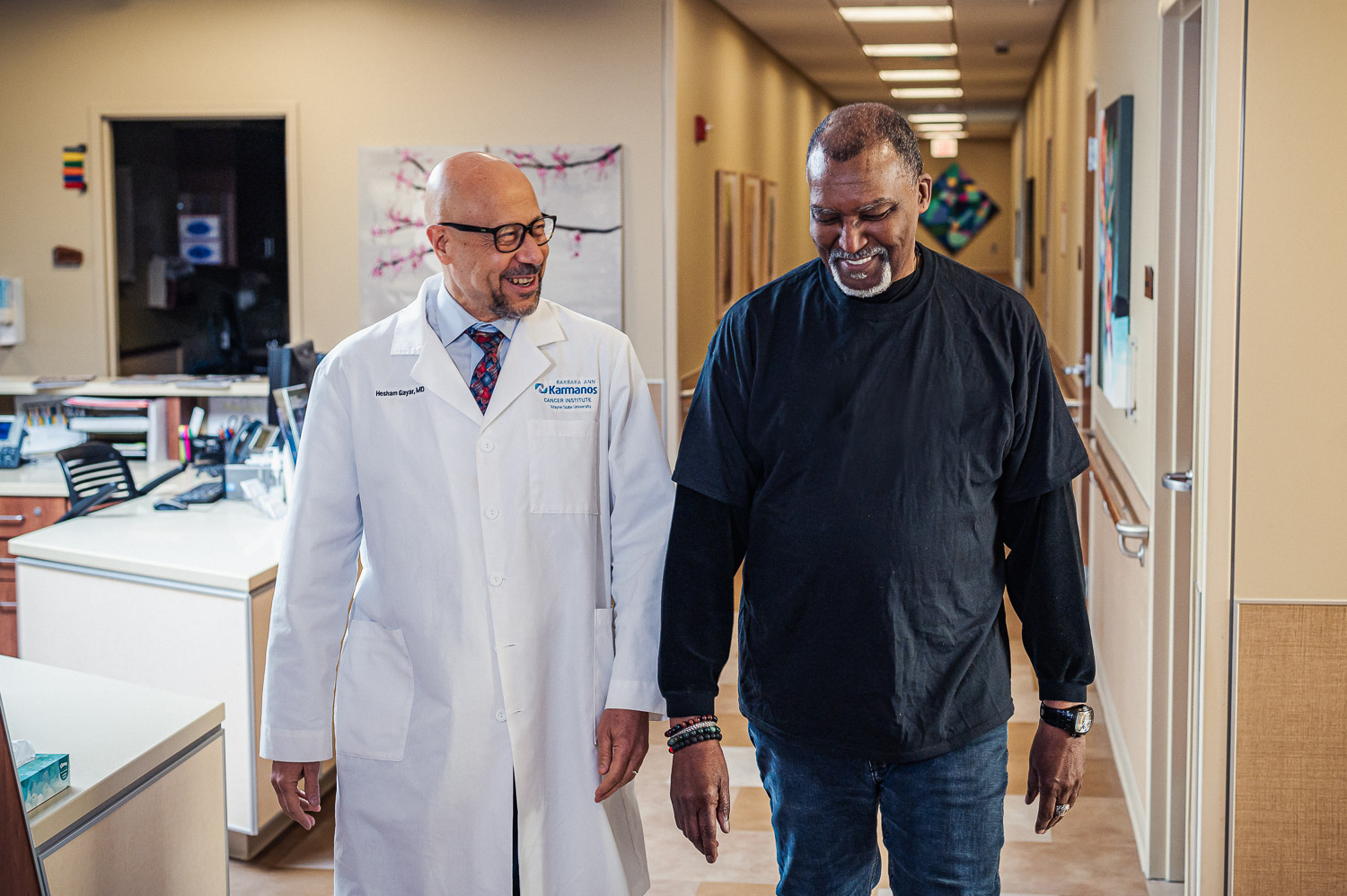 Dr. Gayar and William walking through hallway.