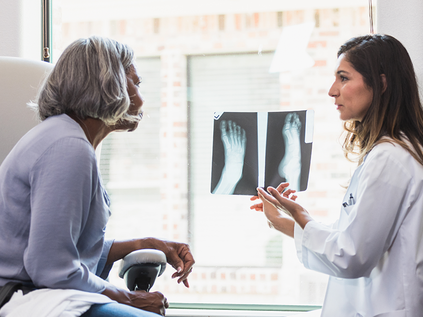 Reviewing x-ray images with patient.