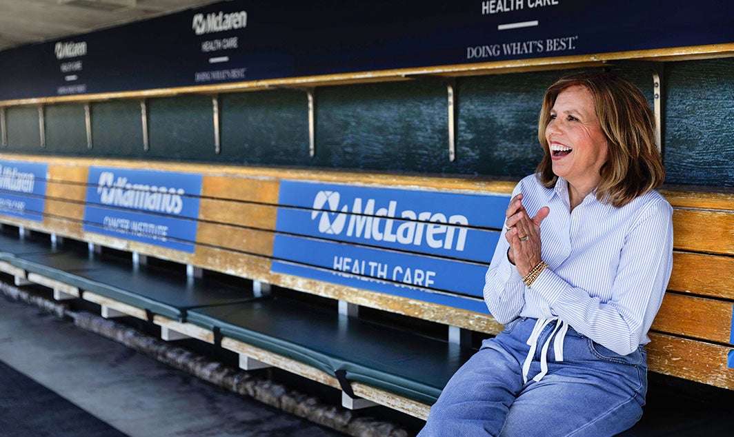 Woman sitting stands at stadium
