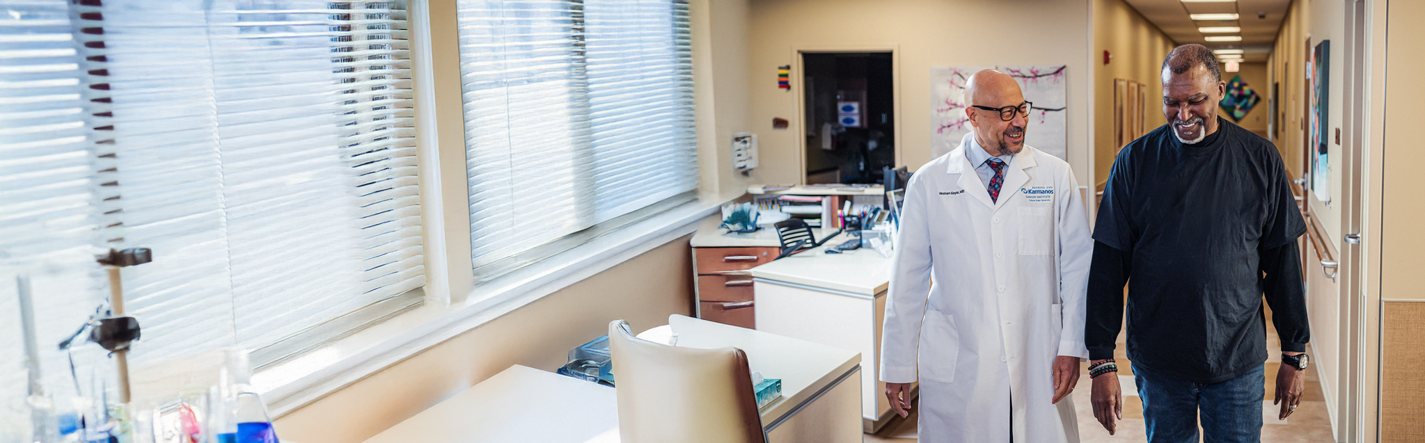 Dr. Gayar and patient walking through hallway.