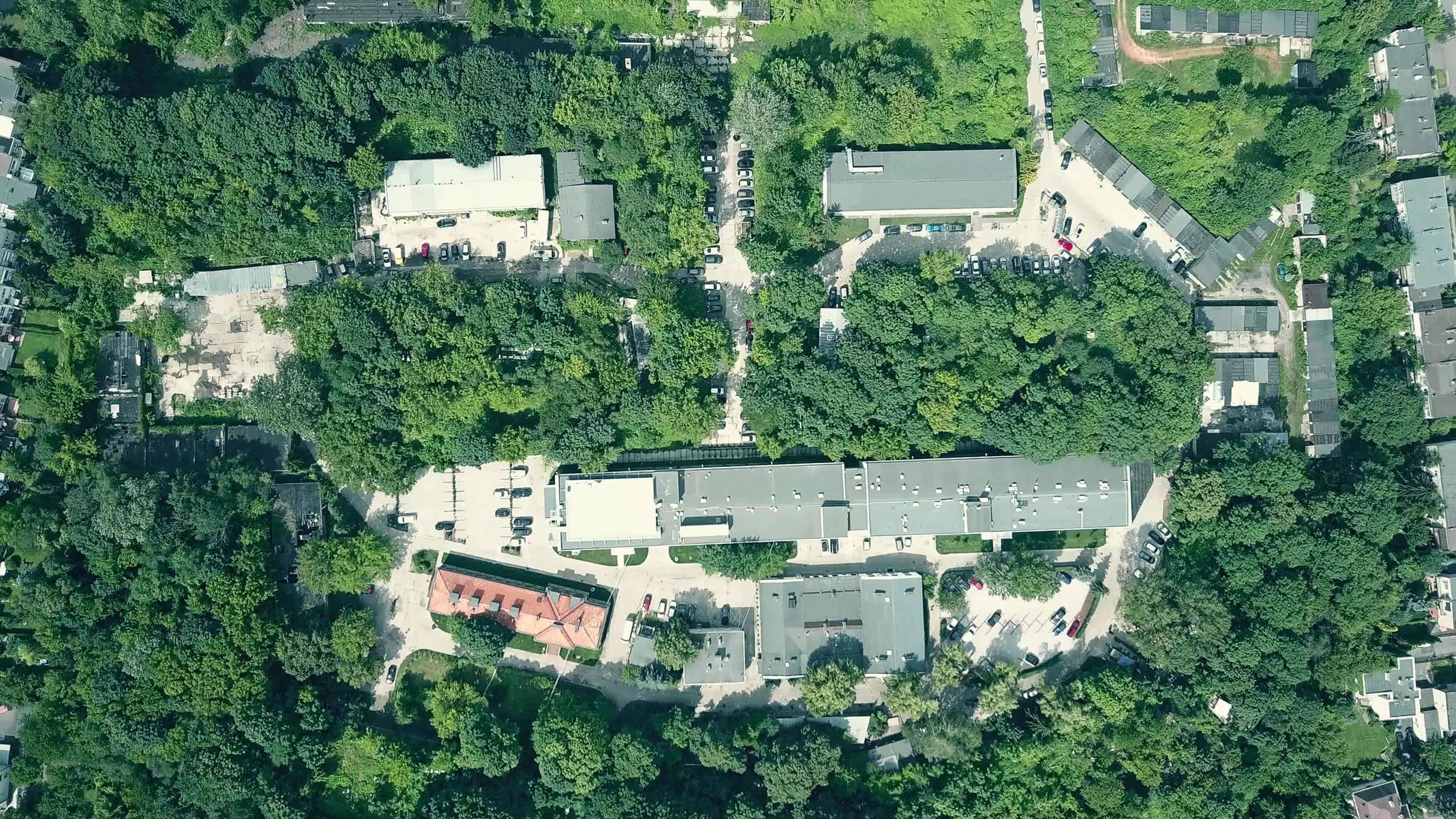 Top view of buildings with trees in the surroundings