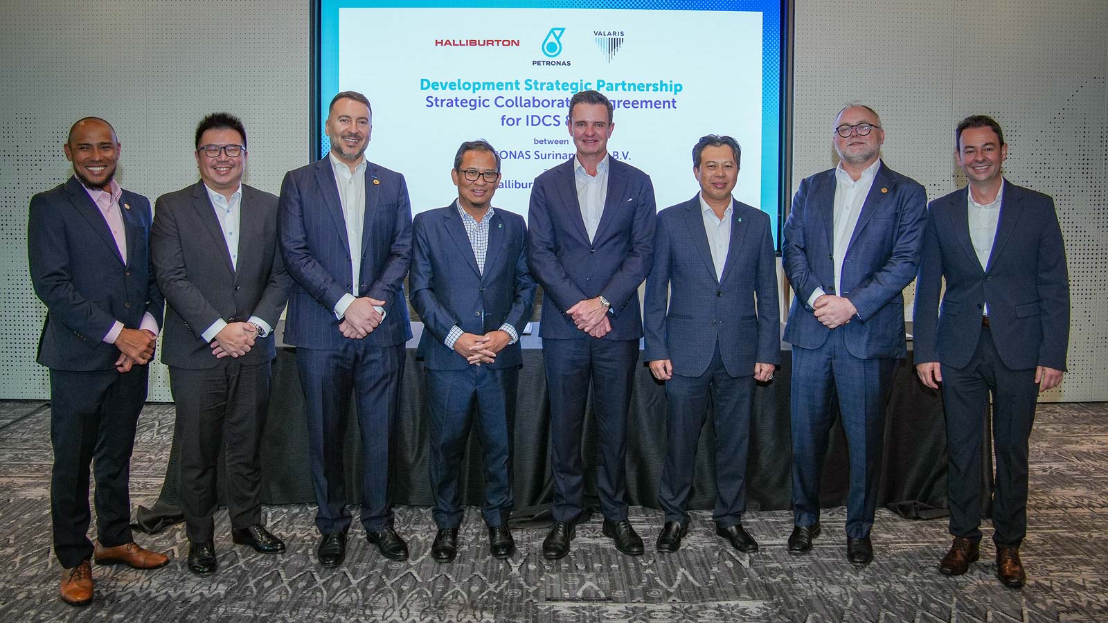 PETRONAS and Halliburton leadership.
