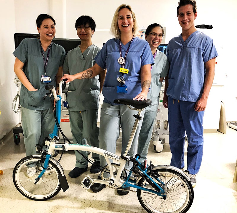 Image of NHS staff in the UK with a free loan Brompton bike