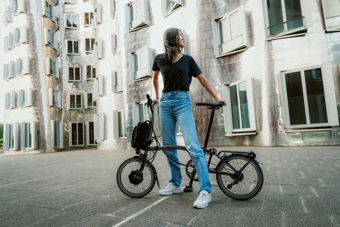 woman stood with brompton bike in dusseldorf