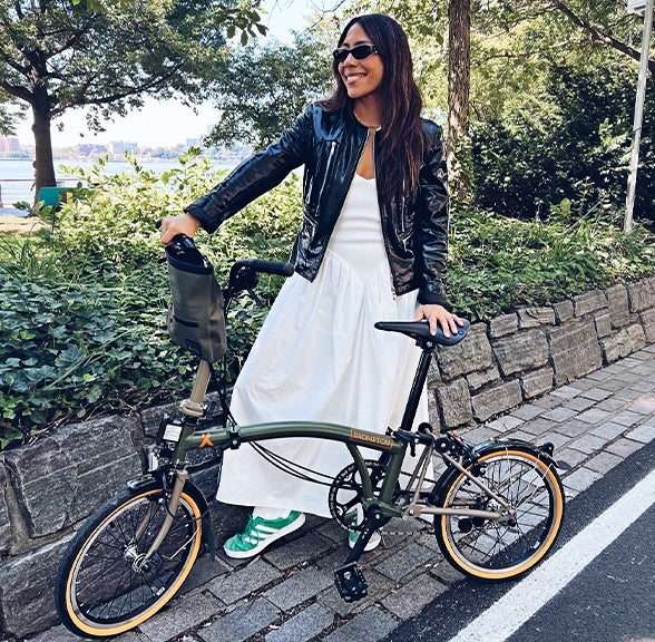 Foodie Nicole Berrie with her Brompton x Bear Grylls folding bike