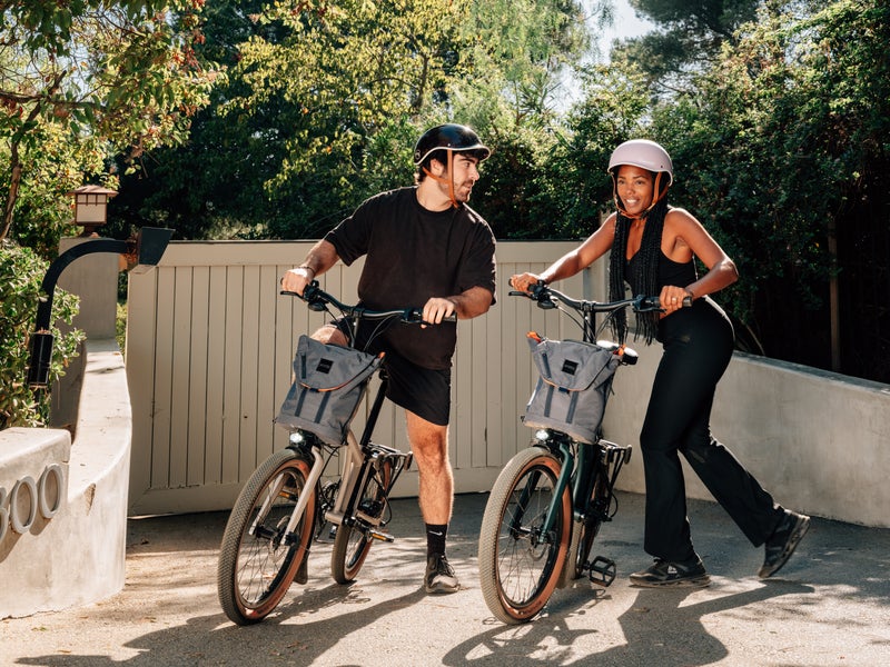 Person riding Brompton Electric G Line bike along path