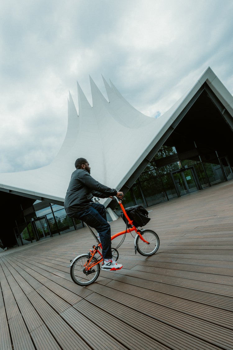 person riding brompton bike in berlin