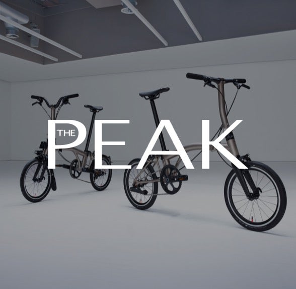 Peak logo over Brompton bicycle