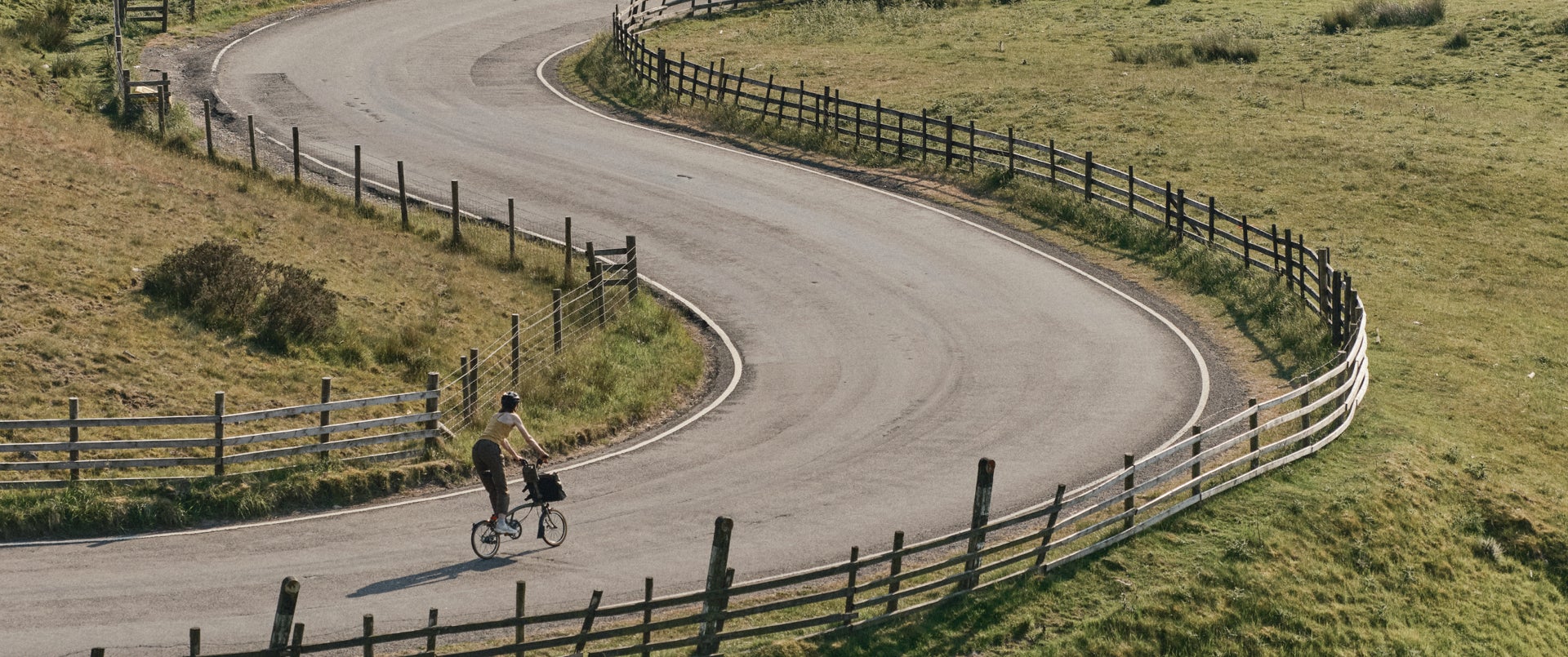 Woman cycling on Bear Grylls Beyond Brompton Bike Collab
