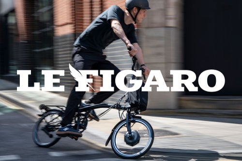 Le Figaro logo over image of someone riding the brompton  p line