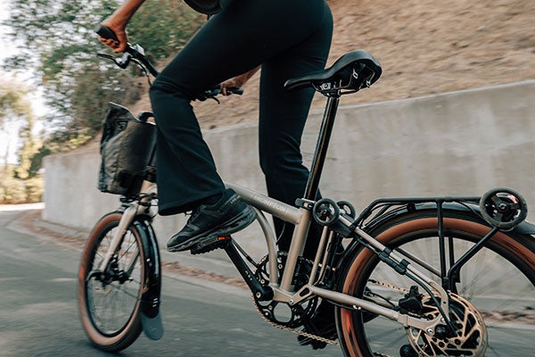 Woman riding orange Electric G Line on an open road