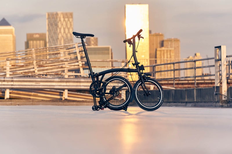 A man posing with a midnight black Brompton P Line