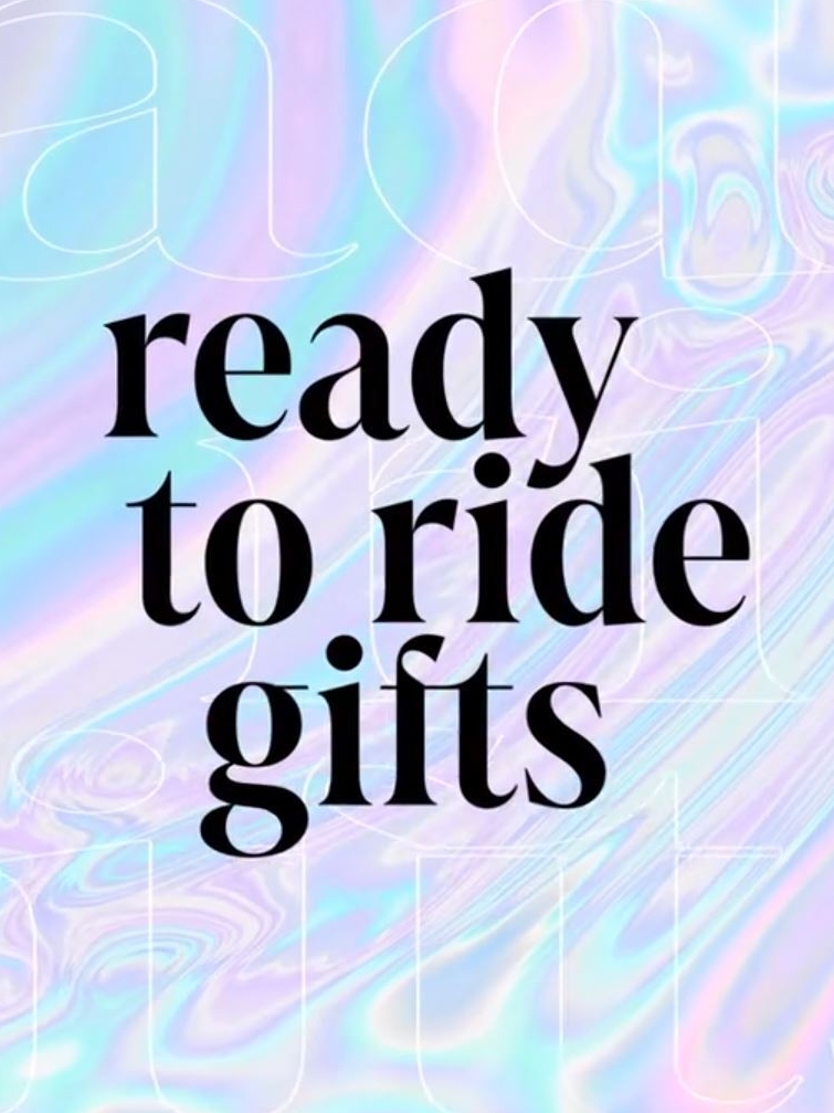 A holographic image with black graphic text, "Ready to ride gifts"