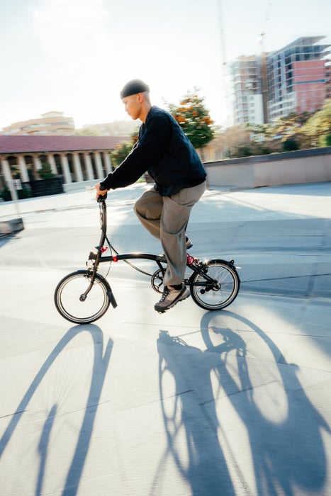 Person on a Brompton bike