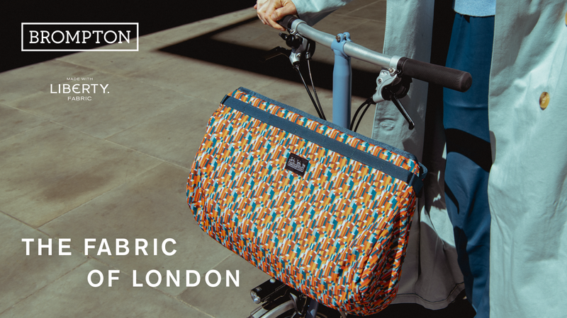 a close up of a Brompton bag made with Liberty fabric in the Metropolis pattern