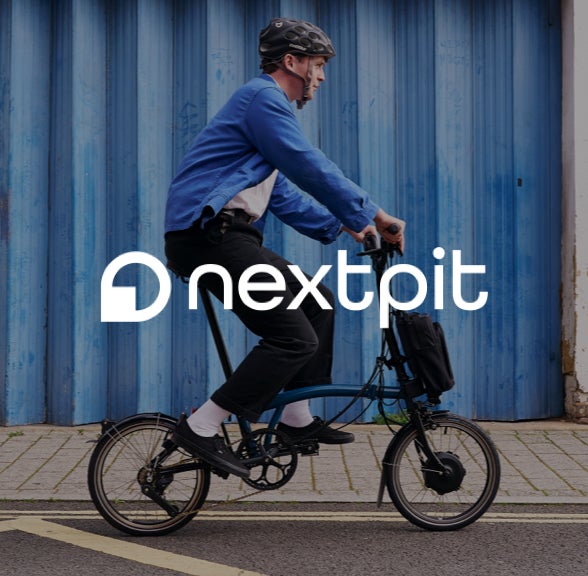 nextpit logo over an image of a person riding a brompton c line