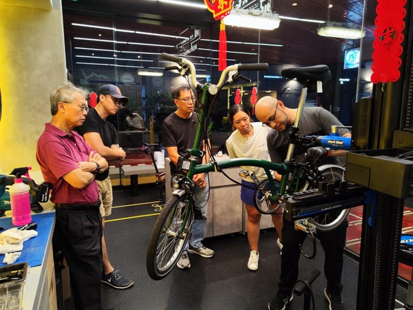 Man working on bike in Singapore Workshop