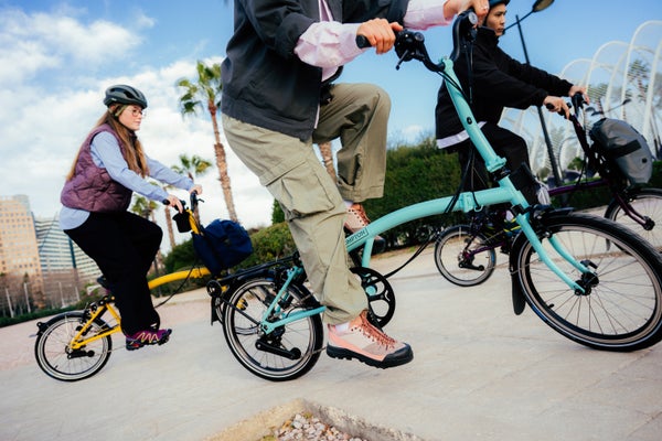 People riding on Brompton bikes
