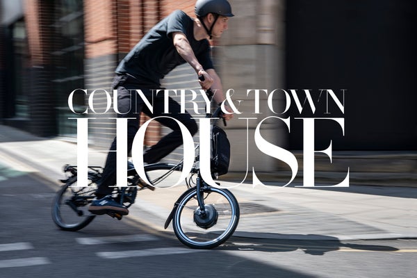Country & Town House logo in white over Brompton bicycle