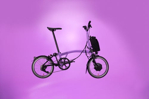 studio shot of the pop lilac electric brompton p line against lilac background