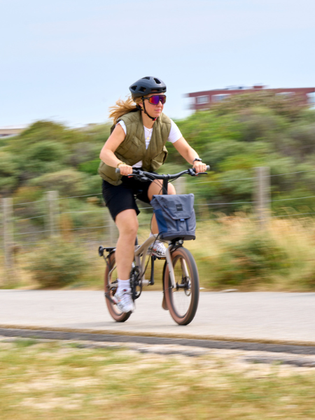 Woman riding on a gravel bike path on the G Line bike