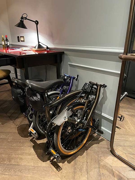 Two folded Brompton bikes