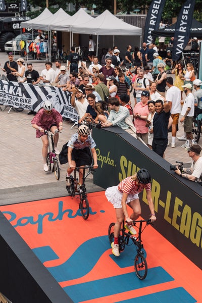 People racing on Brompton bikes