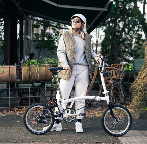 Woman stood next to White A Line Brompton