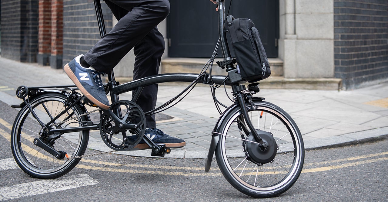 Woman riding Brompton