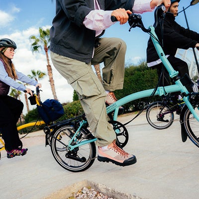 People riding Brompton bikes