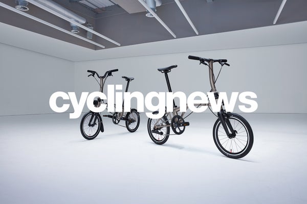Cycling news logo in white over Brompton bicycle