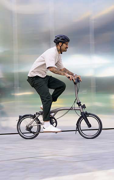 Man riding Brompton bike