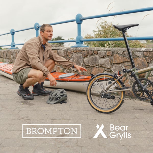 Bear Grylls with his Brompton x Bear Grylls folding bike with the Brompton and Bear Grylls logos overlaid as graphics