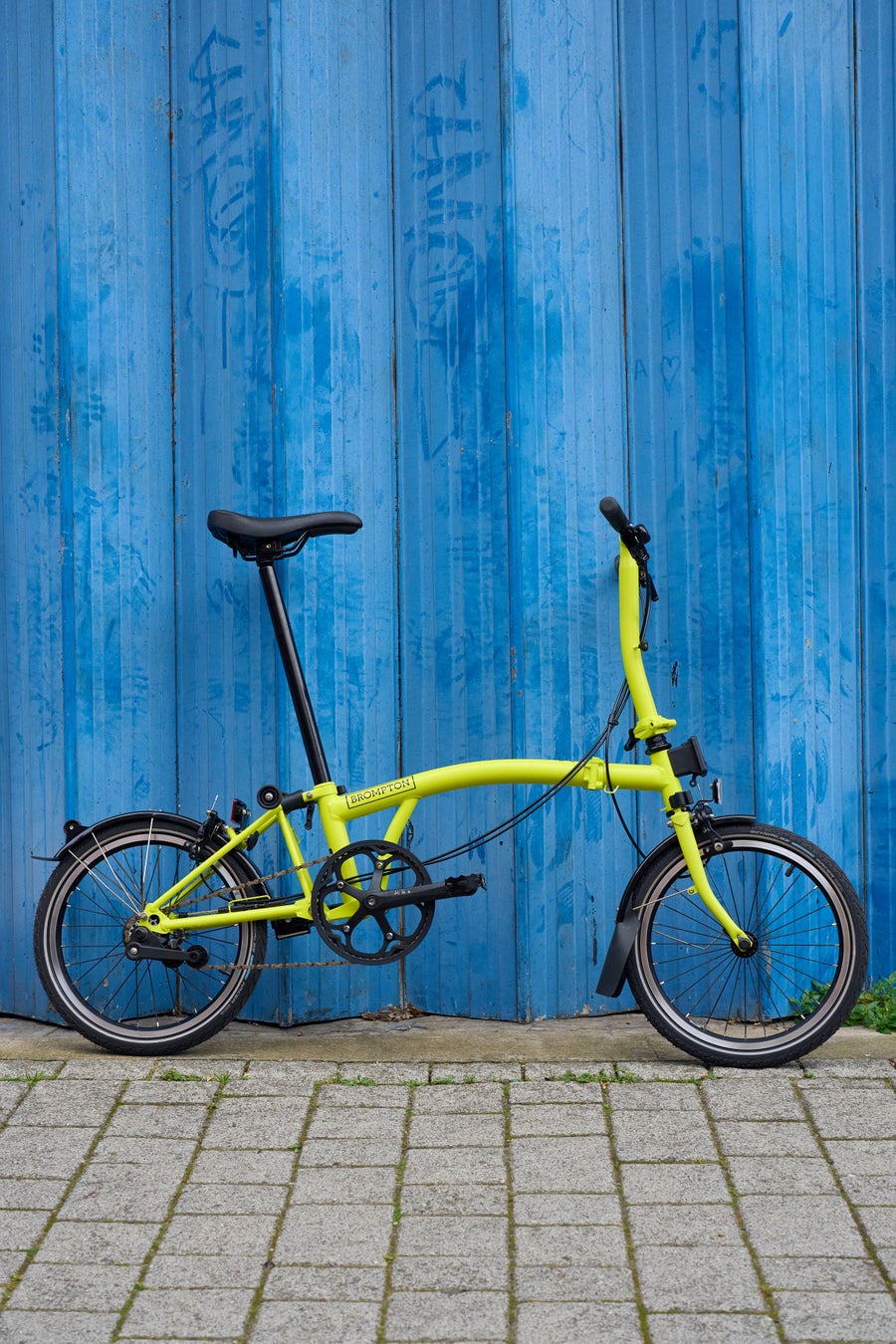 A Yuzu Lime C Line Explore against a wall