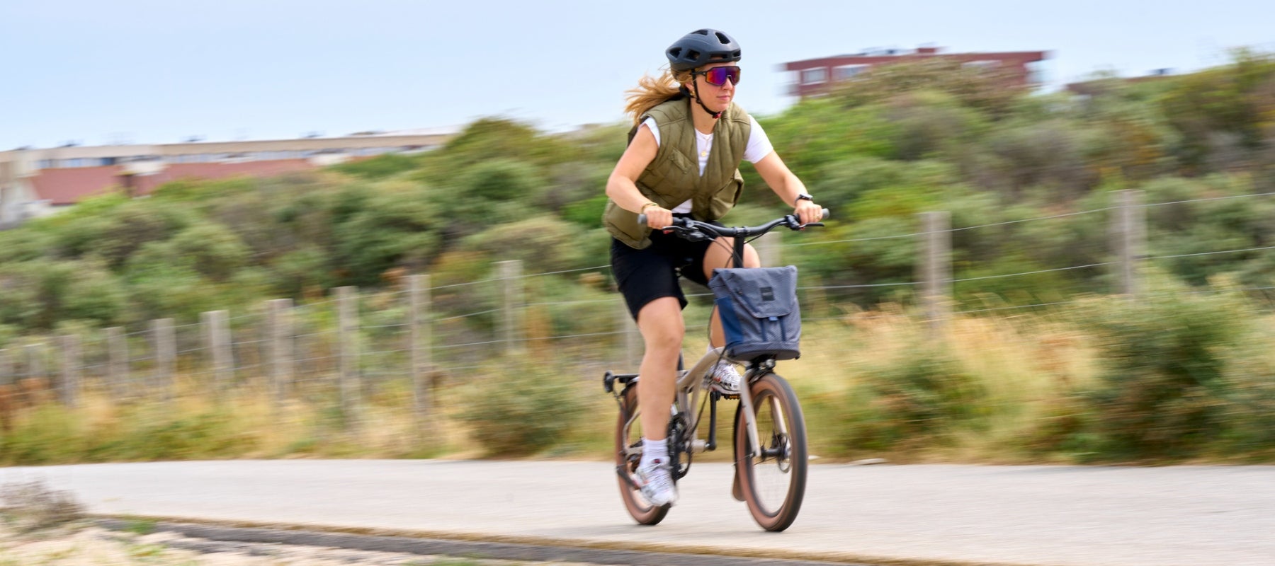 Woman riding on a gravel bike path on the G Line bike