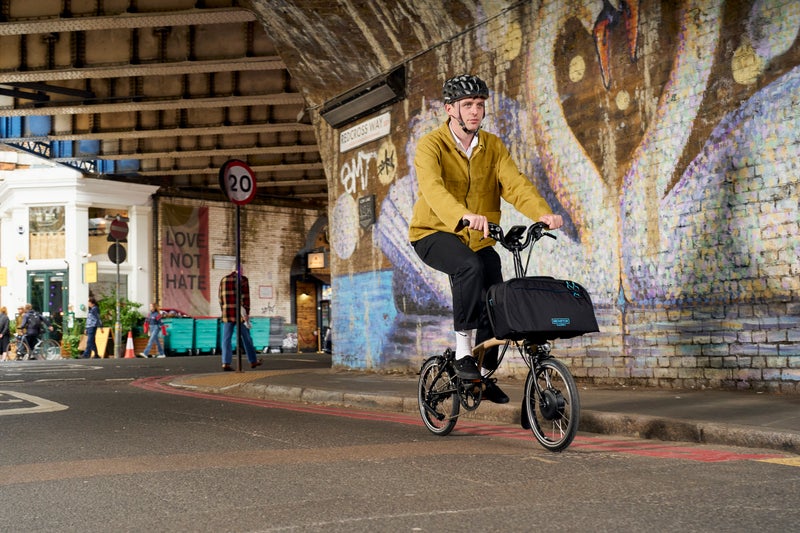 Person riding Brompton Electric bike