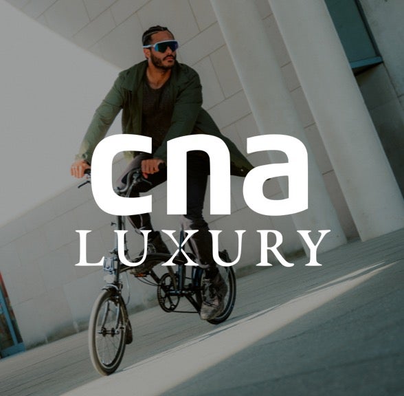 CNA luxury logo over Brompton bicycle