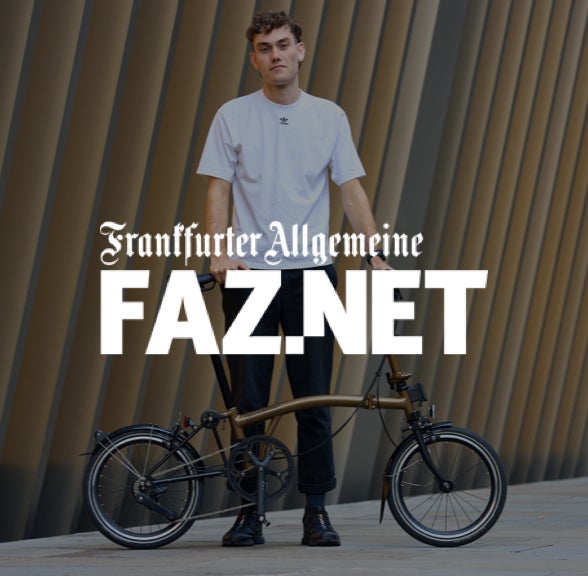 faz.net logo over an image of person standing with Brompton bike