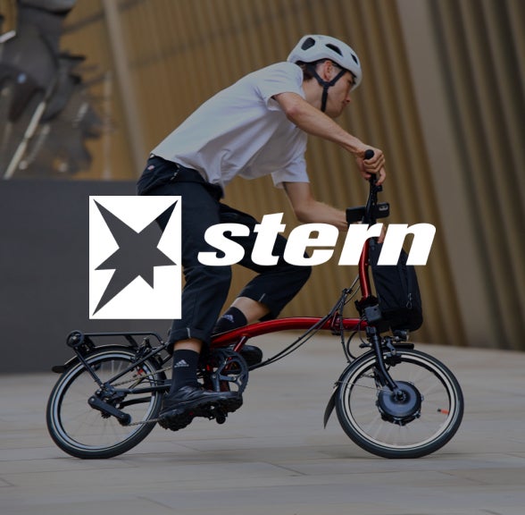 stern logo over an image of a man riding the brompton electric P line urban